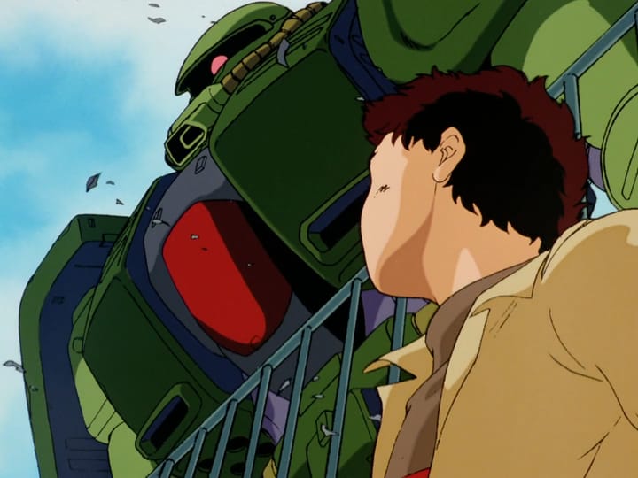 young boy looks up at zaku on school roof